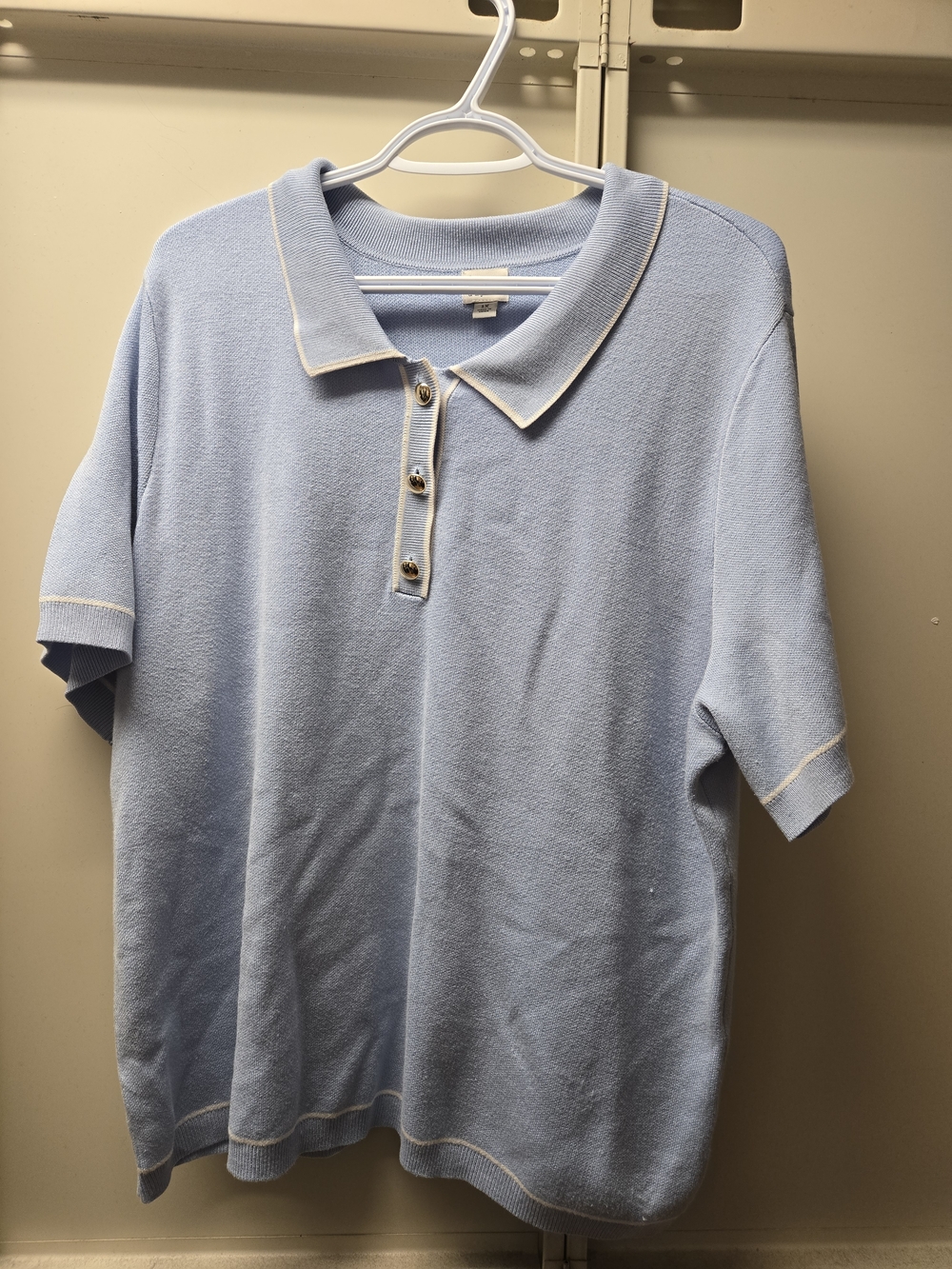 a new day Light Blue Polo with White Trim
